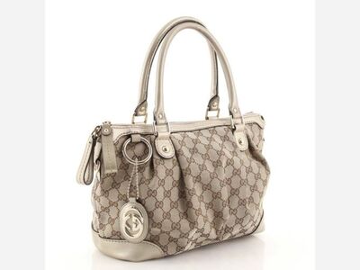 I sugggest, The Gucci Sukey Top Handle Satchel GG Canvas Medium